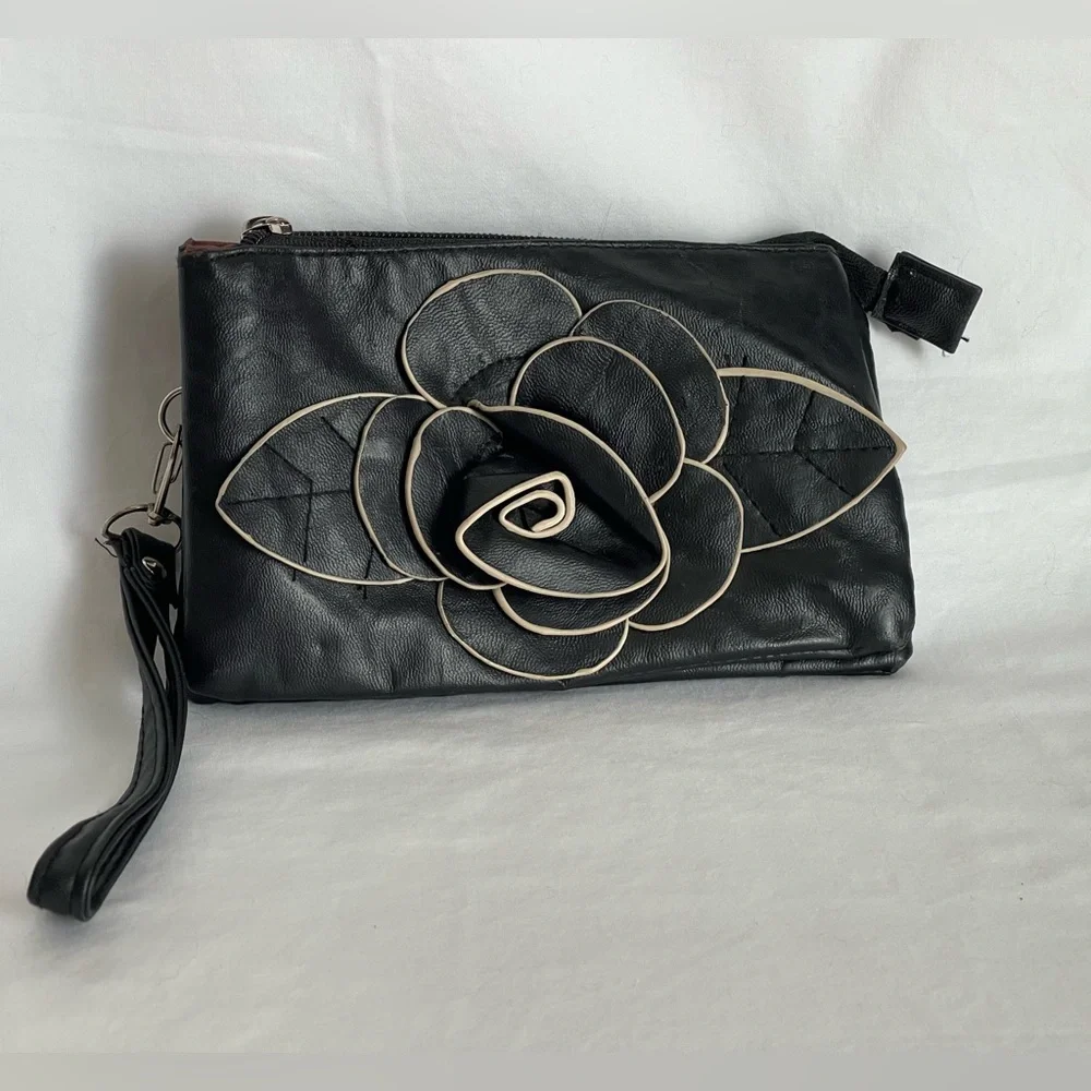 Fun little black faux, leather clutch wristlet three pocket with a zipper